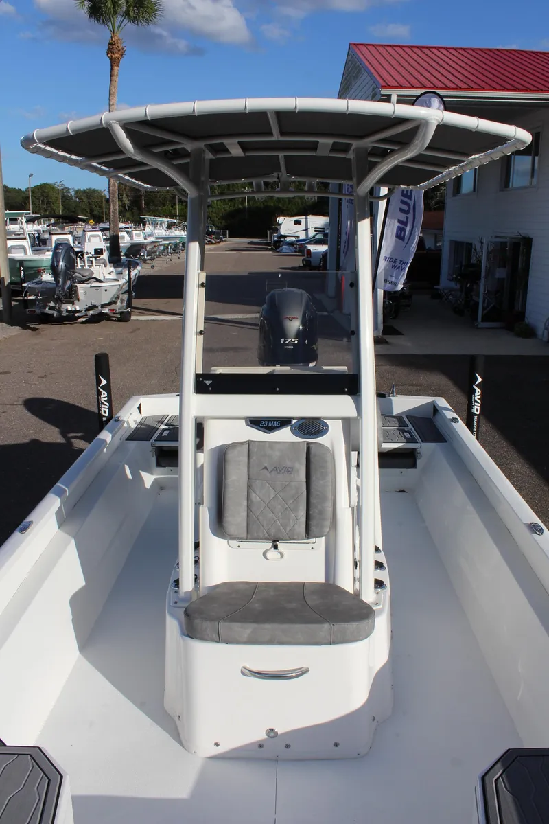 Slide: The Image of 2023 Avid AVID 23 MAG center console boat with T-top in marina. - 11