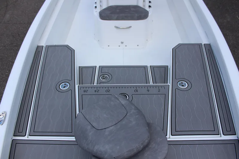 Slide: The Image of 2023 Avid AVID 23 MAG boat interior with gray cushioned seats and deck. - 14