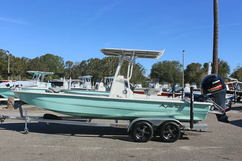 Slide: The Image of 2023 Avid AVID 23 MAG boat on trailer, parked outdoors. - 16