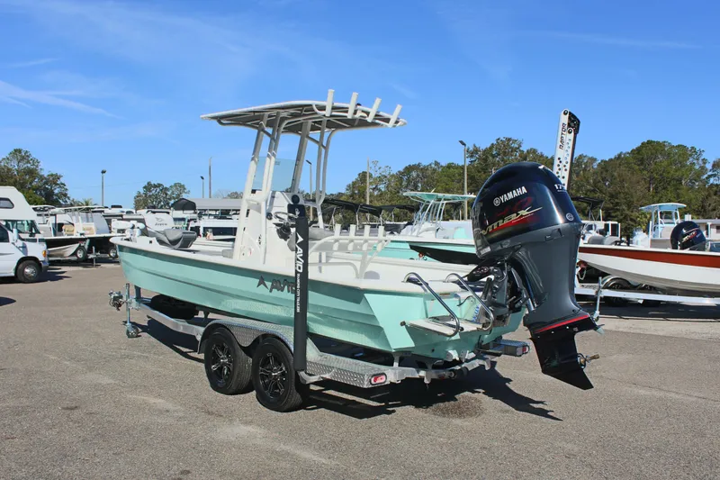 Slide: The Image of 2023 Avid AVID 23 MAG boat with Yamaha engine on trailer, parked outdoors. - 17