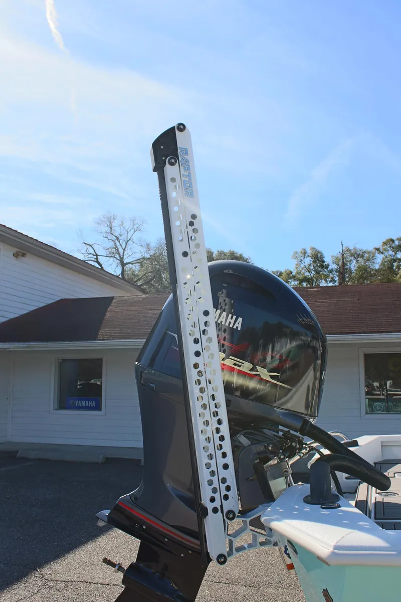 Slide: The Image of Avid 23 MAG 2023 boat with Yamaha outboard motor in sunny outdoor setting. - 19