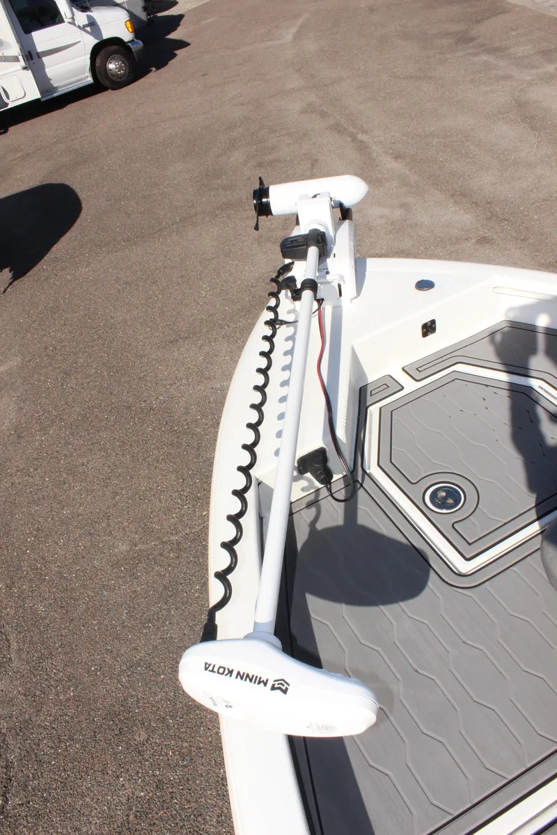 Slide: The Image of Avid 23 MAG 2023 boat with Minn Kota trolling motor on deck. - 23