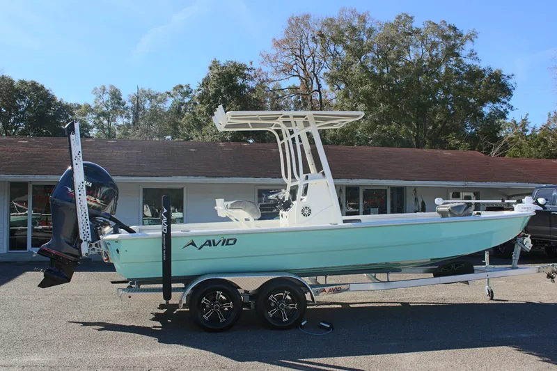 Slide: The Image of 2023 Avid AVID 23 MAG boat on trailer, parked outdoors. - 3