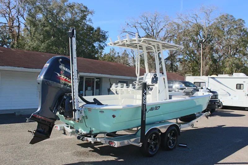 Slide: The Image of 2023 Avid AVID 23 MAG boat with Yamaha engine on trailer, parked outdoors. - 4