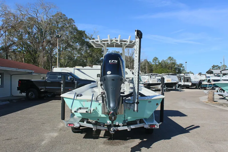 Slide: The Image of 2023 Avid AVID 23 MAG boat with 175 HP engine, parked outdoors. - 5