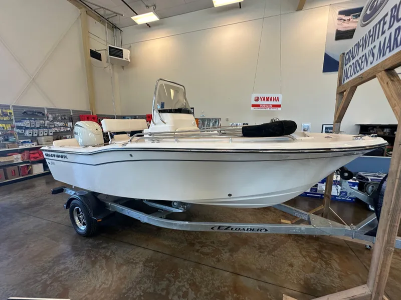The Image of 2025 Grady-White Fisherman 180 boat displayed indoors on a trailer. - 0