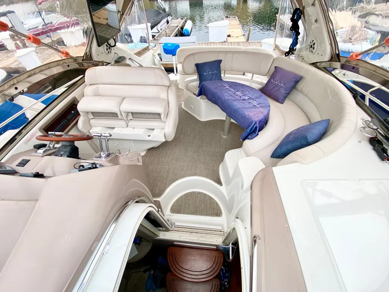 Slide: The Image of Luxurious interior of 2002 Regal 3860 Commodore yacht with plush seating and elegant design. - 13