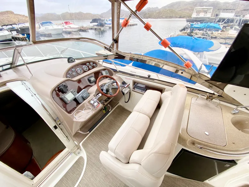 Slide: The Image of Interior view of 2002 Regal 3860 Commodore yacht at marina. - 14