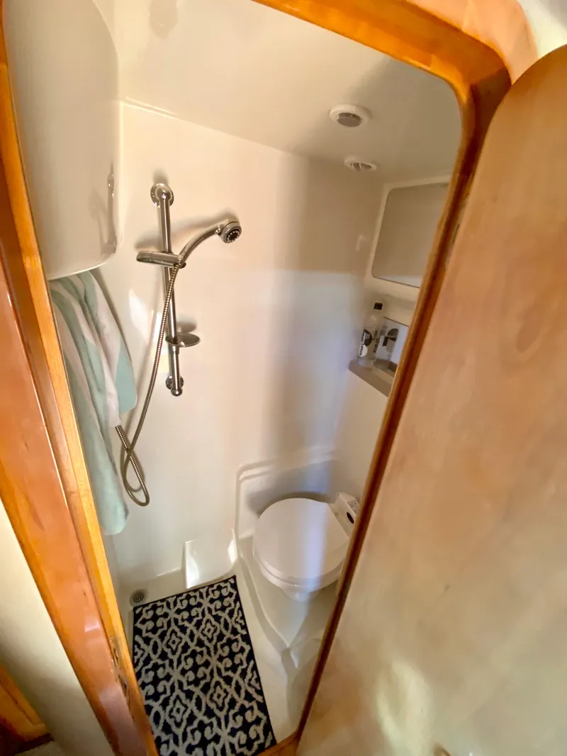 Slide: The Image of 2002 Regal 3860 Commodore yacht bathroom with shower and toilet. - 33