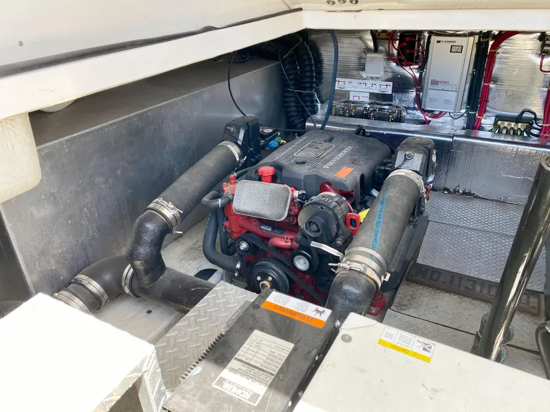 Slide: The Image of Engine compartment of 2002 Regal 3860 Commodore boat, showcasing mechanical components. - 38