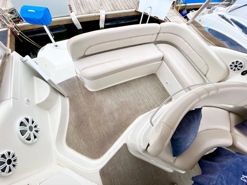 Slide: The Image of 2002 Regal 3860 Commodore boat interior with beige seating and carpeted floor. - 6