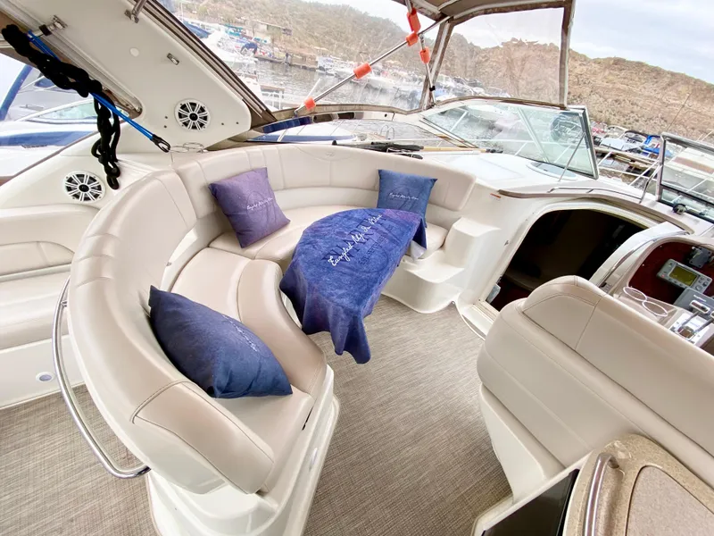 Slide: The Image of Luxurious interior of 2002 Regal 3860 Commodore yacht with plush seating and cushions. - 8