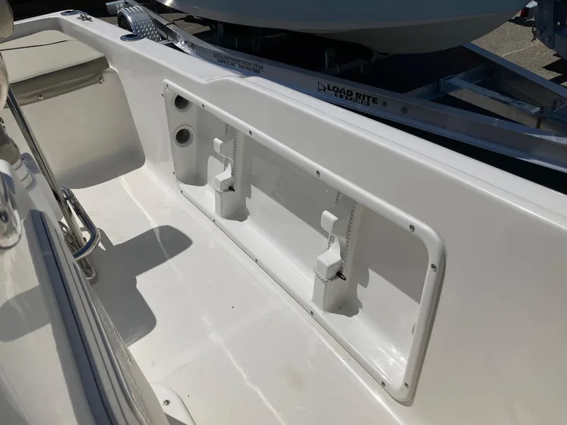 Slide: The Image of 2024 Key West 1720 Sportsman boat interior, showing storage compartments and seating area. - 8