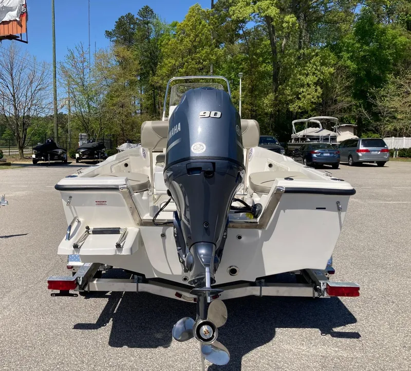 Slide: The Image of 2024 Key West 1720 Sportsman boat with Yamaha 90 engine, rear view in parking lot. - 3