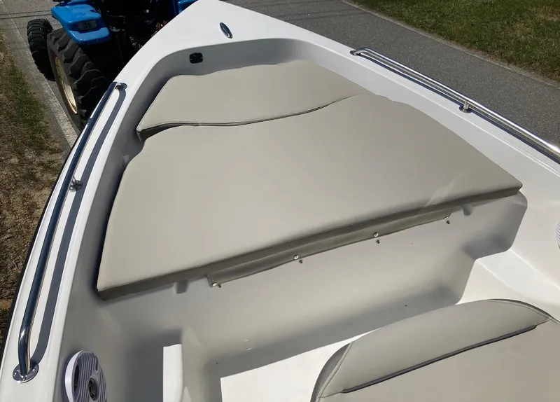 Slide: The Image of 2024 Key West 1720 Sportsman boat interior with cushioned seating. - 4