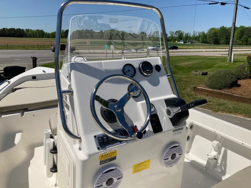 Slide: The Image of 2024 Key West 1720 Sportsman boat console with steering wheel and gauges. - 6