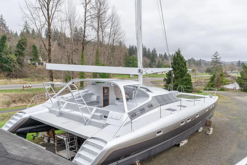 Slide: The Image of 2025 Shuttleworth 52 AeroRig yacht on land, showcasing sleek design and modern features. - 1