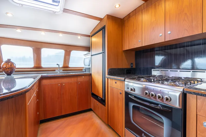 Slide: The Image of Luxurious kitchen interior of 2025 Shuttleworth 52 AeroRig yacht with modern appliances. - 27