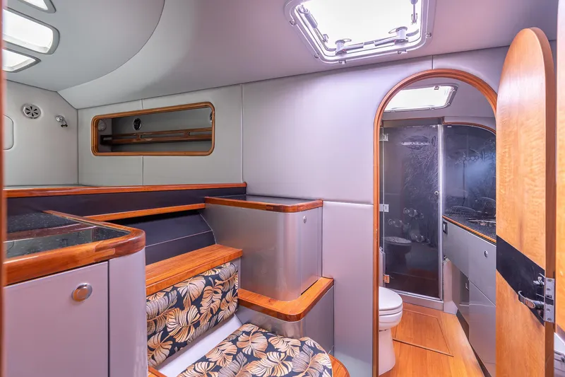 Slide: The Image of Interior of 2025 Shuttleworth 52 AeroRig yacht, featuring modern design and wood accents. - 32