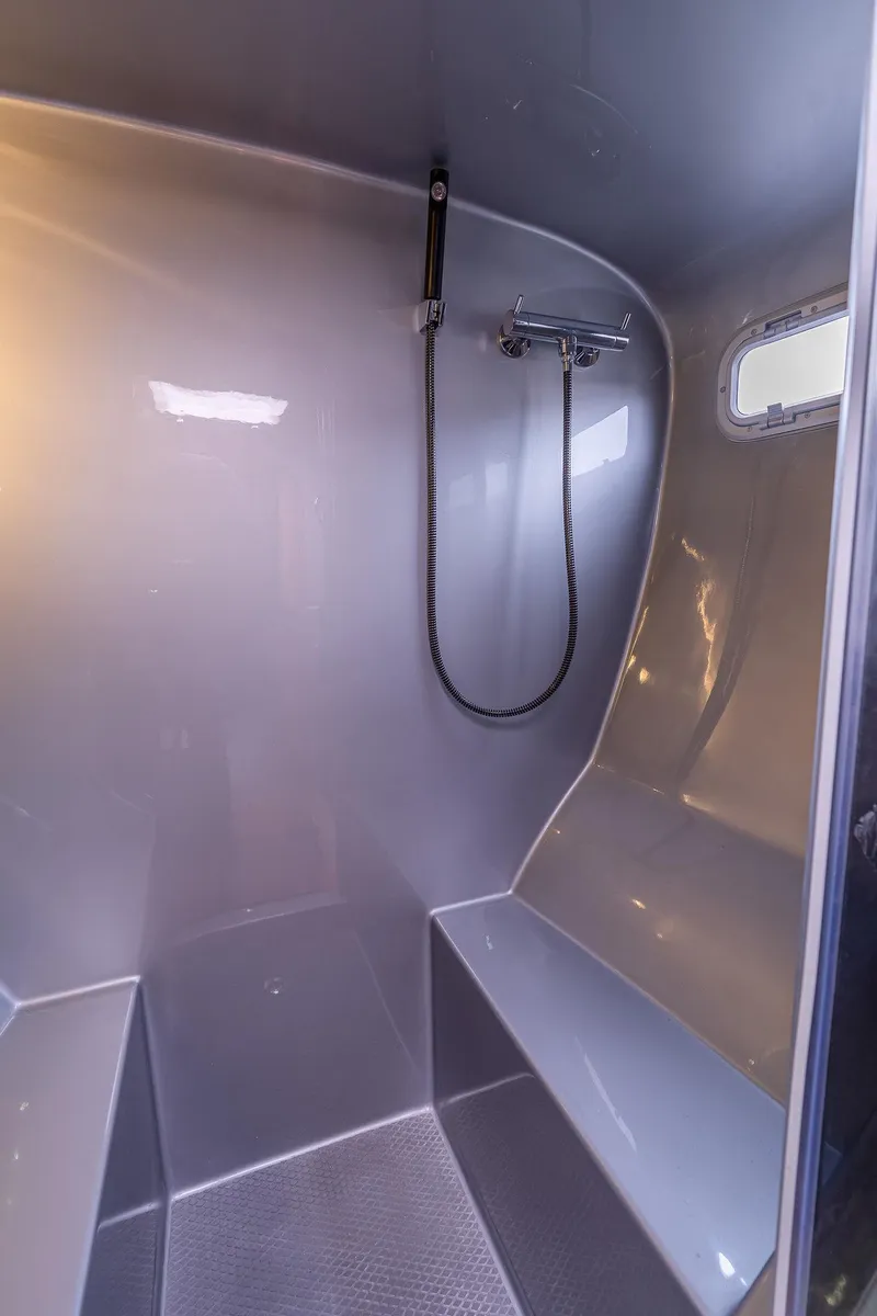 Slide: The Image of Modern shower area in 2025 Shuttleworth 52 AeroRig yacht, featuring sleek design and built-in seating. - 35