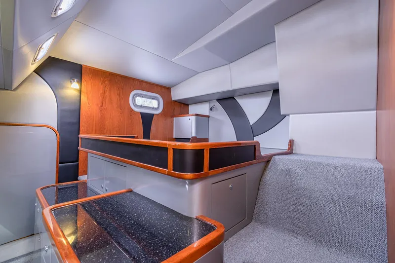 Slide: The Image of Interior of 2025 Shuttleworth 52 AeroRig yacht, featuring modern design with wood and gray accents. - 38