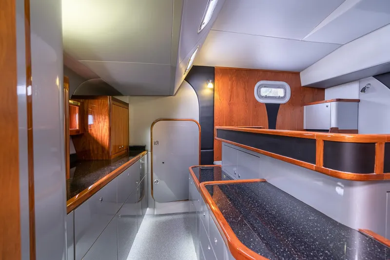 Slide: The Image of Luxurious interior of 2025 Shuttleworth 52 AeroRig yacht with modern design and wood accents. - 39