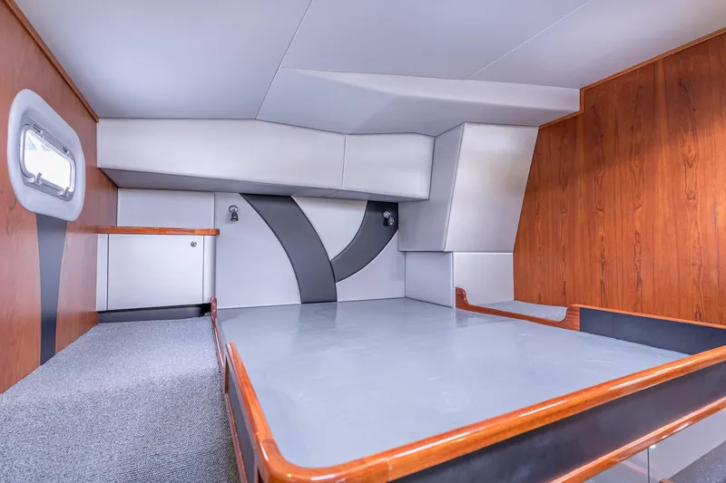 Slide: The Image of Interior of 2025 Shuttleworth 52 AeroRig yacht, featuring modern design and wood accents. - 40