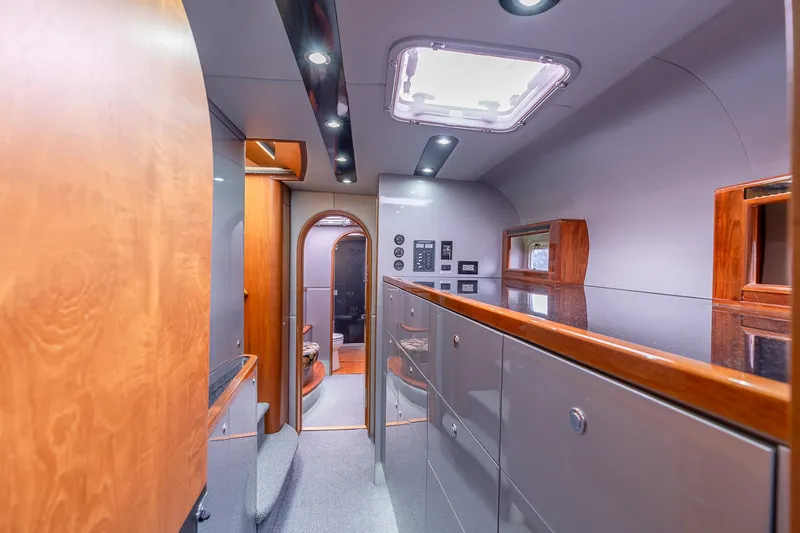Slide: The Image of Interior of 2025 Shuttleworth 52 AeroRig yacht, featuring modern design and wood accents. - 41