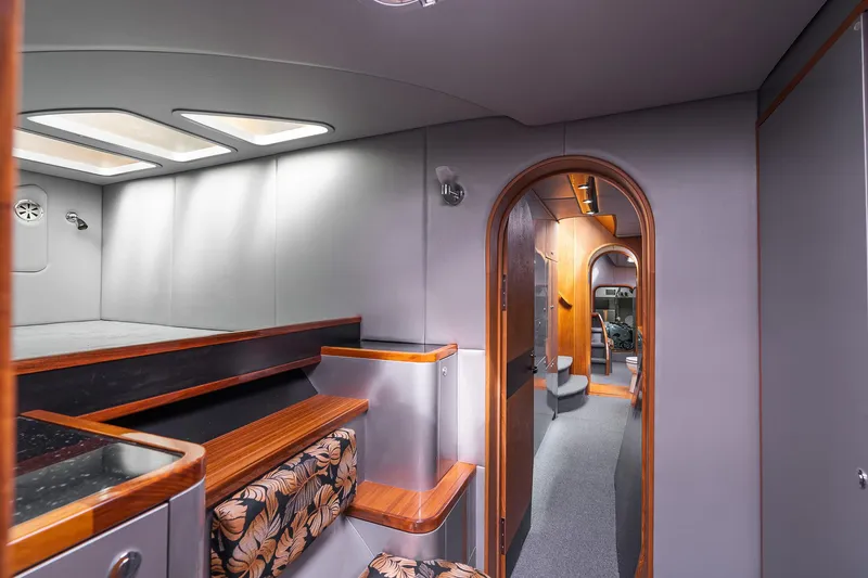 Slide: The Image of Luxurious interior of 2025 Shuttleworth 52 AeroRig yacht with modern design and wood accents. - 46