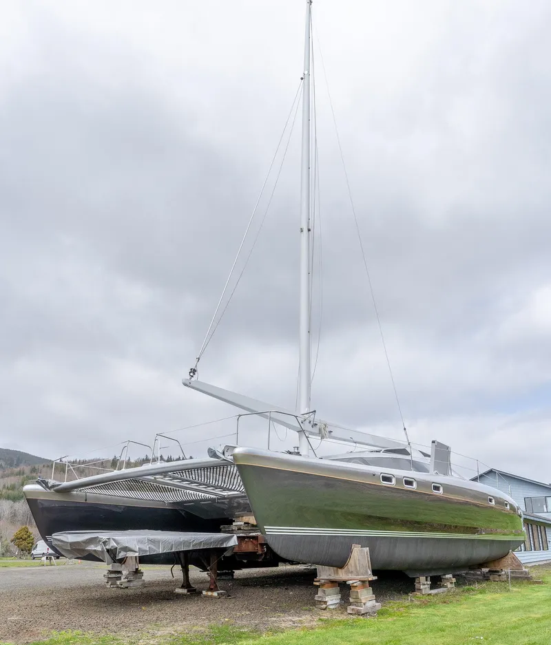 Slide: The Image of 2025 Shuttleworth 52 AeroRig sailboat on land, cloudy sky background. - 6
