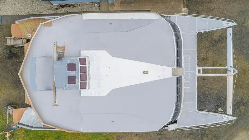 Slide: The Image of Aerial view of 2025 Catamaran Bloomfield 86 Motorsailor, showcasing deck layout and design. - 13