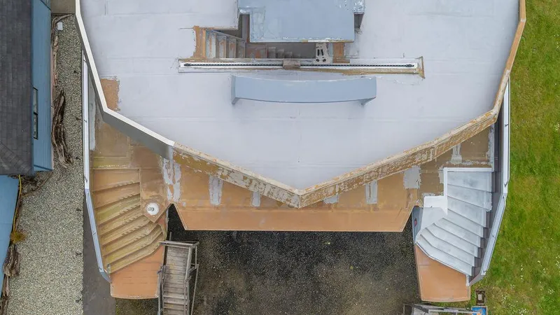 Slide: The Image of Aerial view of a 2025 Catamaran Bloomfield 86 Motorsailor under construction, showcasing deck layout. - 20
