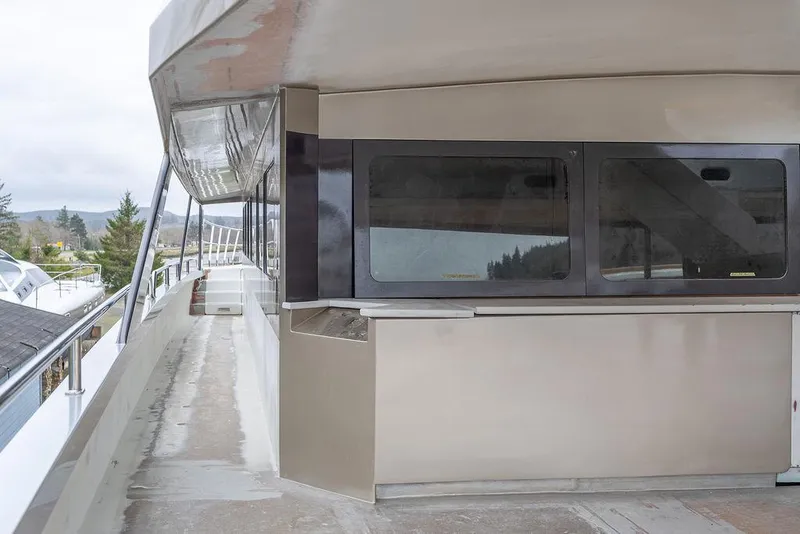 Slide: The Image of 2025 Catamaran Bloomfield 86 Motorsailor deck with sleek design and modern windows. - 29