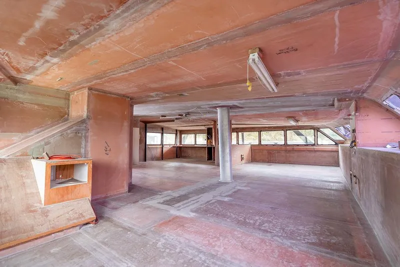 Slide: The Image of Spacious interior of 2025 Catamaran Bloomfield 86 Motorsailor, featuring unfinished wooden surfaces. - 39
