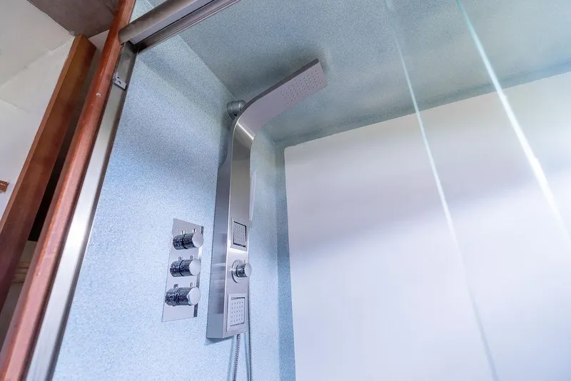 Slide: The Image of Modern shower in 2025 Catamaran Bloomfield 86 Motorsailor, featuring sleek fixtures and glass enclosure. - 43