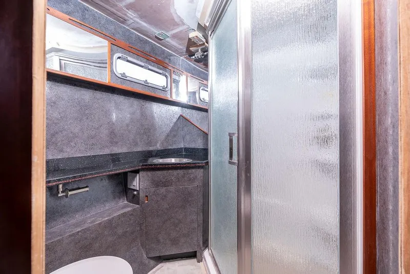 Slide: The Image of Modern bathroom interior on 2025 Catamaran Bloomfield 86 Motorsailor, featuring sleek design and shower. - 46