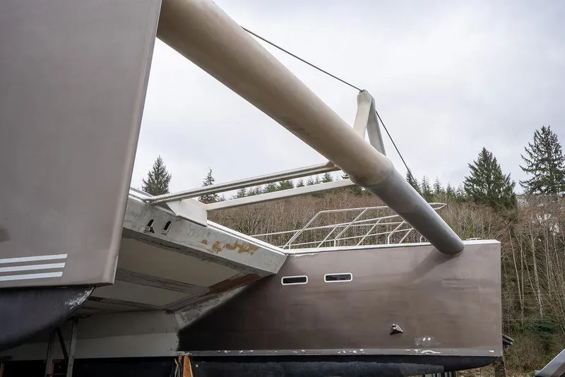 Slide: The Image of 2025 Catamaran Bloomfield 86 Motorsailor, docked, showcasing sleek design and modern features. - 6