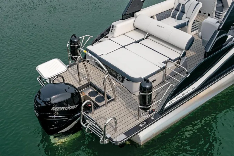 Slide: The Image of 2022 Harris Grand Mariner 250 pontoon boat with Mercury outboard engine on water. - 17