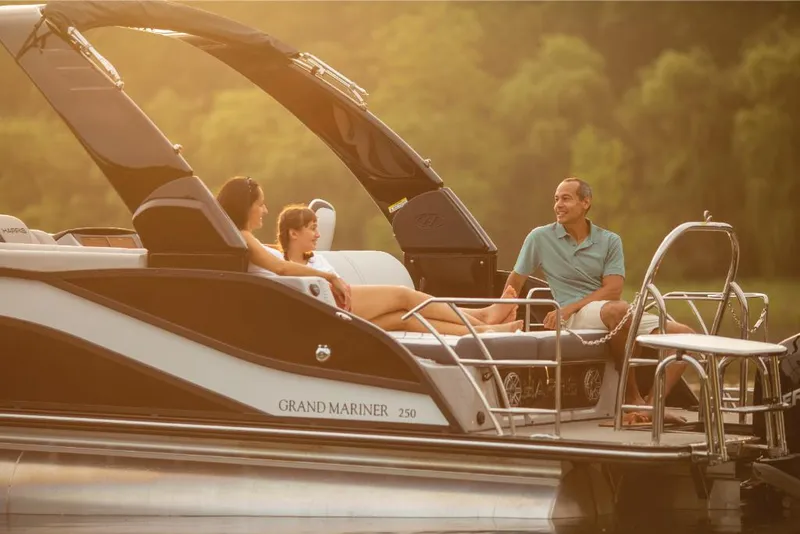 Slide: The Image of 2022 Harris Grand Mariner 250 pontoon boat with people relaxing onboard. - 27