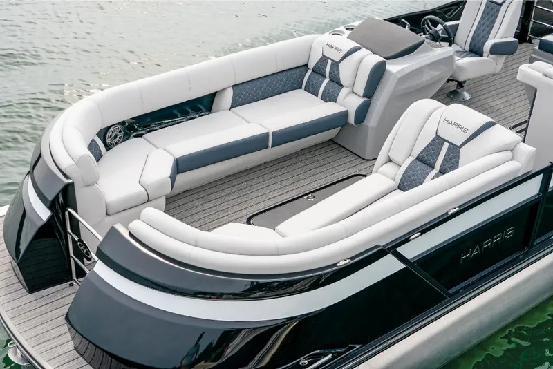 Slide: The Image of 2022 Harris Grand Mariner 250 pontoon boat with luxurious seating on the water. - 4