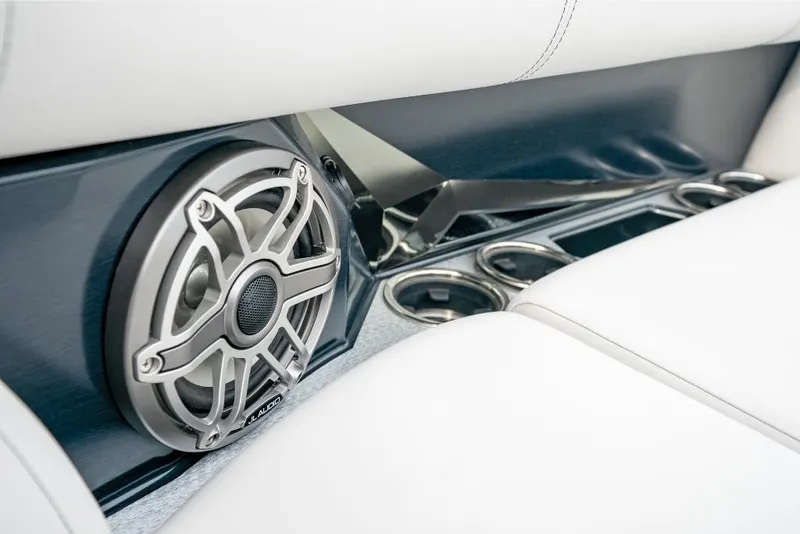 Slide: The Image of Close-up of 2022 Harris Grand Mariner 250 boat interior speaker and cup holders. - 6