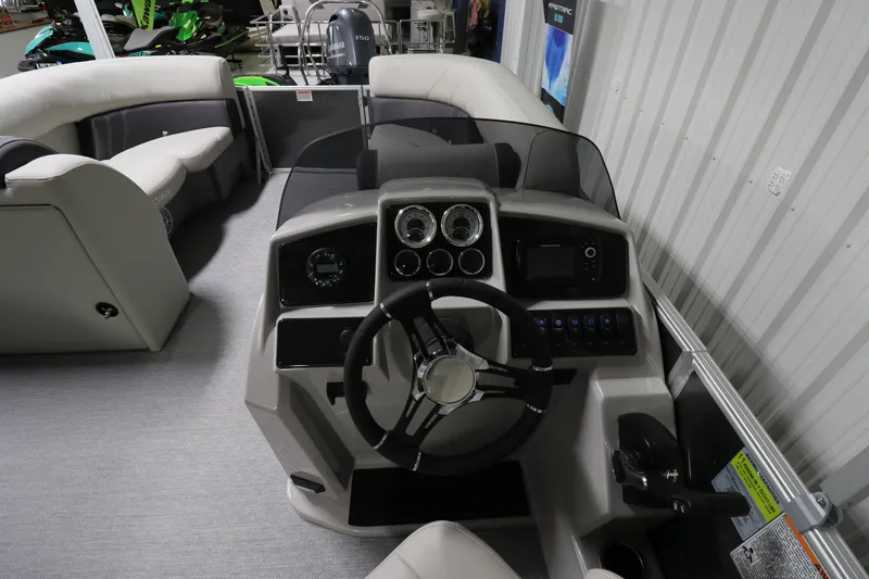 Slide: The Image of 2023 Sylvan Mirage 8522 LZ boat interior with steering console and seating. - 6
