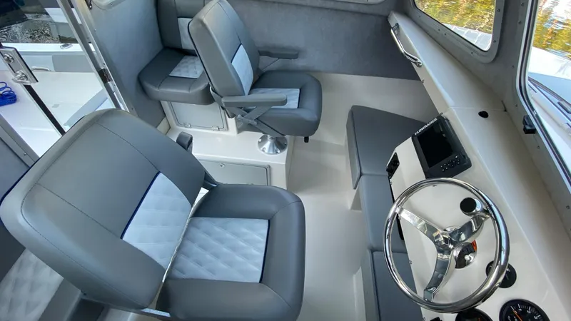 Slide: The Image of 2024 Defiance 220 Admiral EX boat interior with grey and white seating. - 7