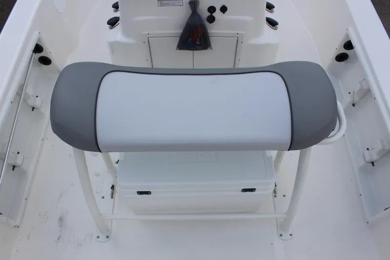 Slide: The Image of 2022 NauticStar 195 XTS boat interior with cushioned seating and storage. - 11