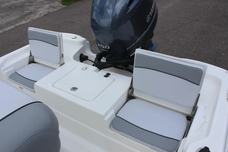 Slide: The Image of 2022 NauticStar 195 XTS boat with Yamaha 150 engine and cushioned seating. - 17