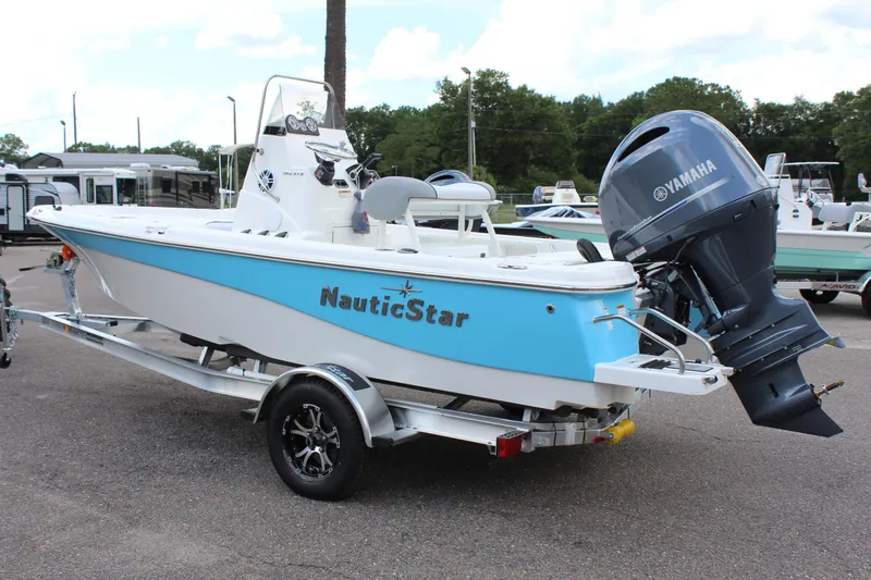 Slide: The Image of 2022 NauticStar 195 XTS boat on trailer with Yamaha outboard motor. - 3