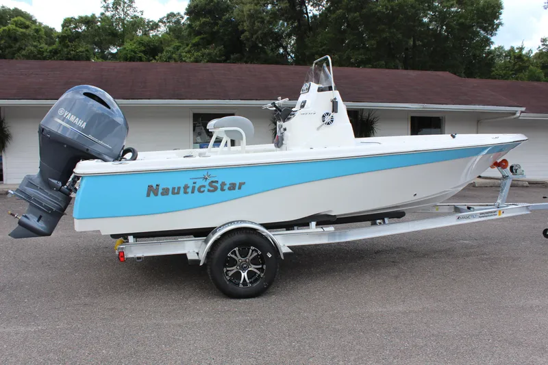 Slide: The Image of 2022 NauticStar 195 XTS boat on trailer with Yamaha outboard motor. - 7