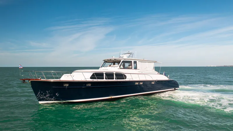Slide: The Image of 2008 Huckins Linwood yacht cruising on open water. - 0