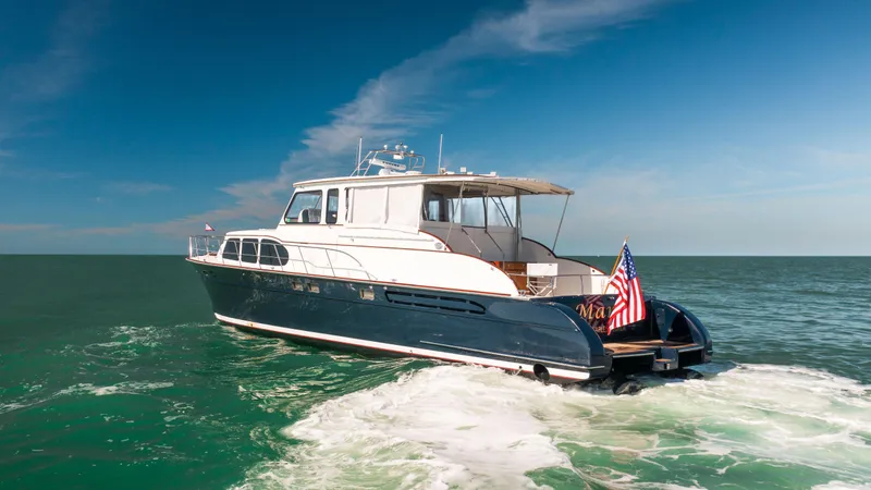 Slide: The Image of 2008 Huckins Linwood yacht cruising on open water. - 3