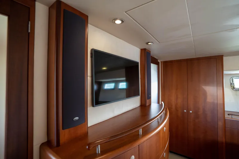 Slide: The Image of Luxurious interior of 2008 Huckins Linwood yacht with TV and wooden cabinetry. - 30